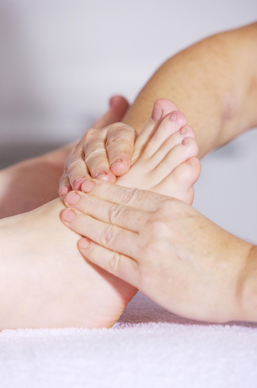 Licensed chiropractor performing gentle foot and ankle adjustments to improve mobility and reduce pain
